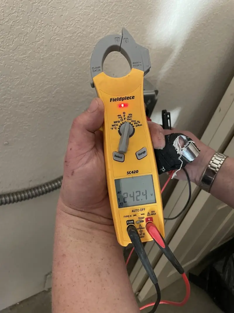 Voltage testing with clamp meter during Hot Tub / Pool Electrical Wiring in Overland